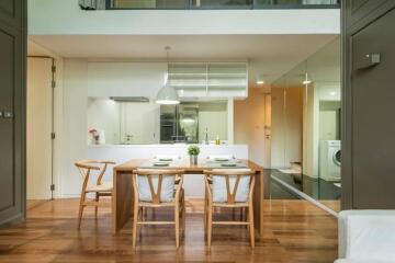 Modern kitchen and dining area with wooden furniture