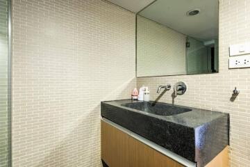 Modern bathroom with a sleek designed sink and mirror