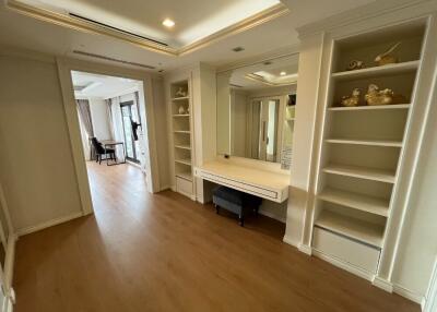 Hallway with built-in shelves and mirror