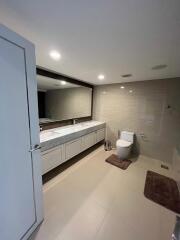 Modern bathroom with a large mirror and dual sinks