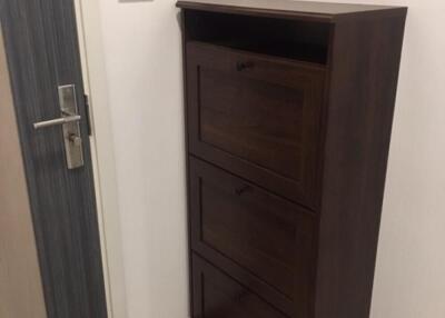 Wooden shoe rack in hallway