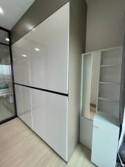 Modern bedroom closet with mirror and storage shelves