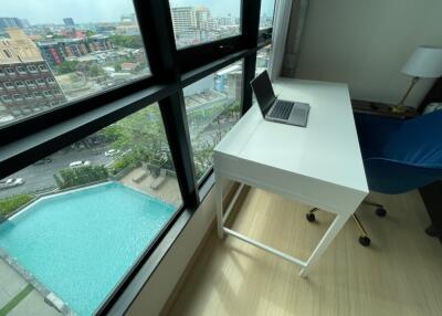 Modern workspace with city view and pool