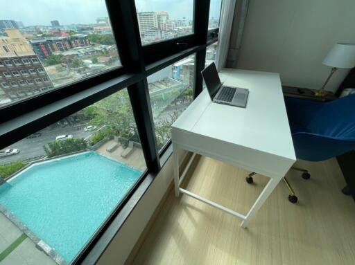 Modern workspace with city view and pool