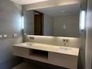 Modern bathroom with double sink and large mirror