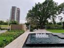 Modern residential complex with landscaped garden and fountain