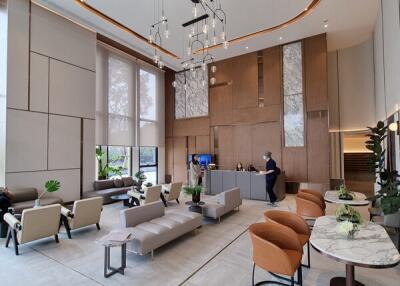 Modern lobby with seating area and high ceilings