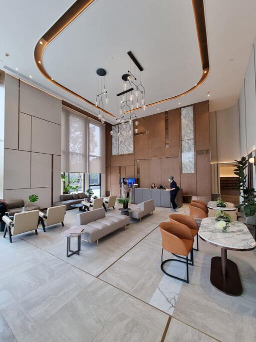 Modern lobby with seating area and high ceilings