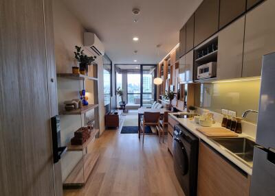 Modern kitchen with integrated appliances and open living space