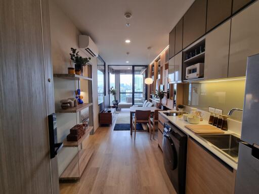 Modern kitchen with integrated appliances and open living space