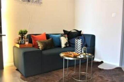 Modern living room with dark couch and coffee table