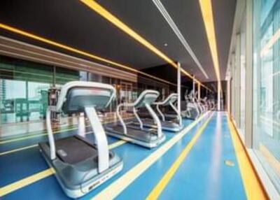 Modern gym with treadmills and large windows