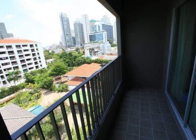 Balcony view of city skyline and nearby buildings