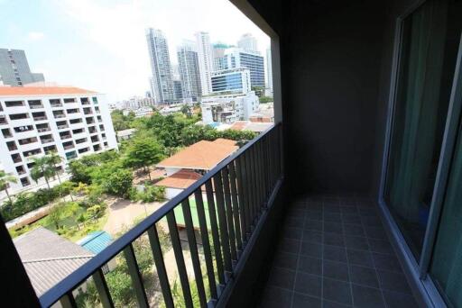 Balcony view of city skyline and nearby buildings