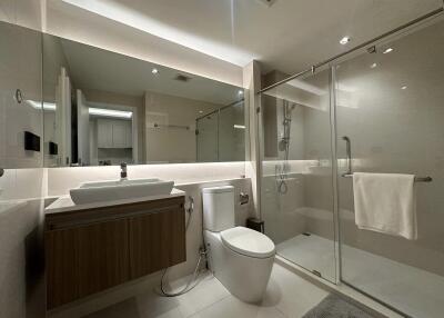 Modern bathroom with glass-enclosed shower