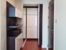 Modern hallway with storage cabinets and wooden flooring