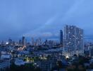 City skyline at dusk with high-rise buildings