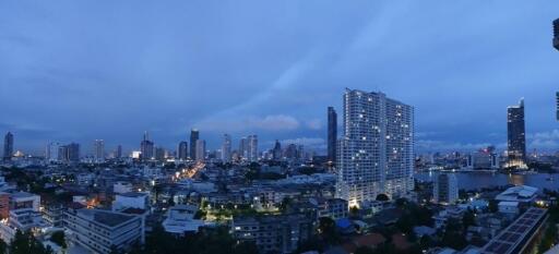 City skyline at dusk with high-rise buildings