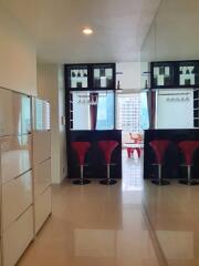 Modern kitchen with bar stools and hanging wine glasses