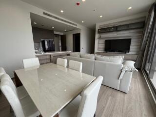 Modern living and dining area with open kitchen layout