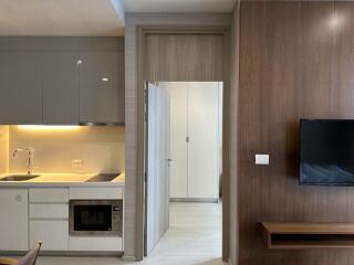 Modern kitchen and living area with open door