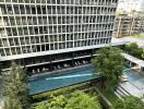 View of modern high-rise building with a swimming pool