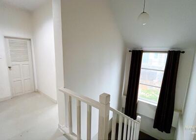 Bright hallway with window and staircase