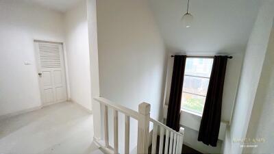 Bright hallway with window and staircase