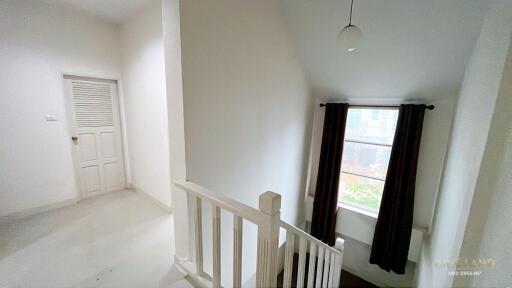 Bright hallway with window and staircase