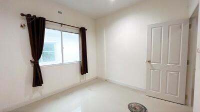 Bedroom with window and door