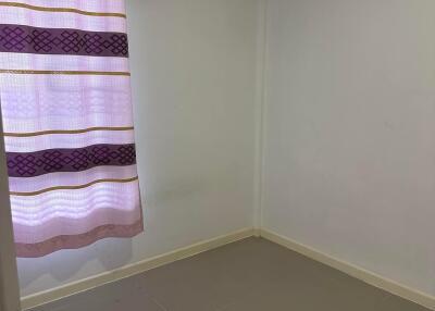 Empty bedroom with air conditioner and curtain