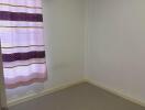 Empty bedroom with air conditioner and curtain