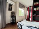 Bedroom with modern decor and unique car-shaped bed