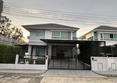 Exterior view of a modern house with a driveway and garage