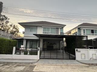 Exterior view of a modern house with a driveway and garage