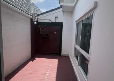 Outdoor courtyard with flooring and windows