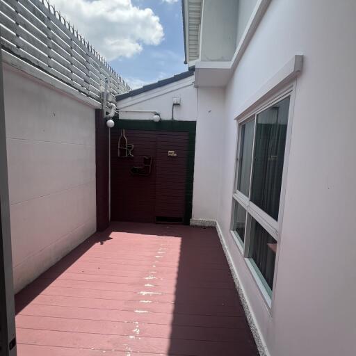 Outdoor courtyard with flooring and windows