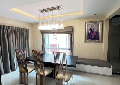 Modern dining room with a stylish chandelier