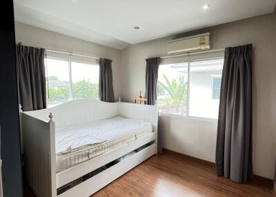 Bedroom with daybed and wooden floor