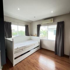 Bedroom with daybed and wooden floor