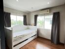 Bedroom with daybed and wooden floor