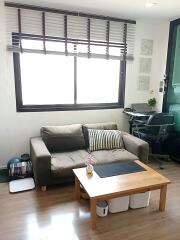 Comfortable living room with a sofa and study area