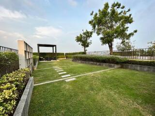 Spacious outdoor area with well-maintained lawn and seating