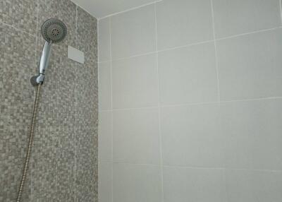 Bathroom shower area with modern tiling