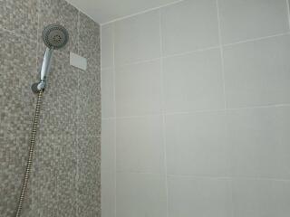 Bathroom shower area with modern tiling