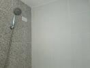 Bathroom shower area with modern tiling