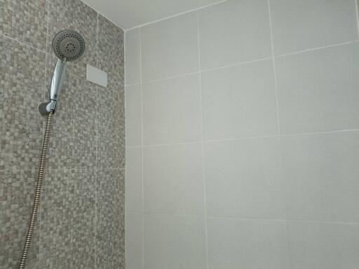 Bathroom shower area with modern tiling