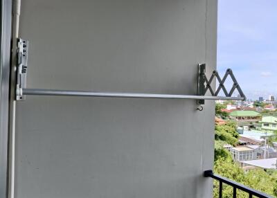 Balcony with a retractable clothes drying rack