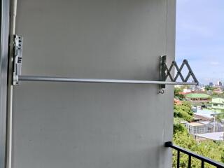 Balcony with a retractable clothes drying rack