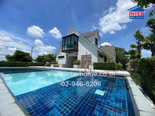 Modern house with pool under a blue sky